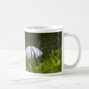 golf ball hiding coffee mug