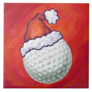 Golf Ball in Santa Hat on Red Ceramic Tile