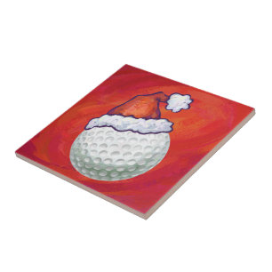 Golf Ball in Santa Hat on Red Ceramic Tile
