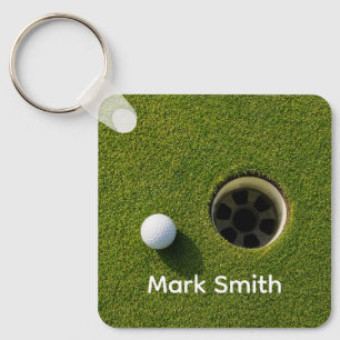 Golf Ball Next to Hole on Green Grass Golf Course  Key Ring