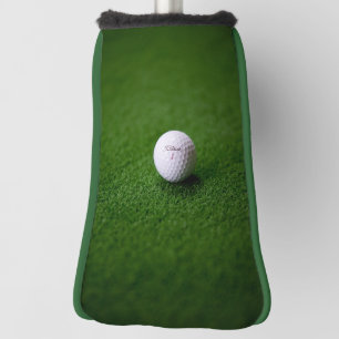 Golf ball on a green surface Putter Golf Head Cove Golf Head Cover
