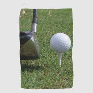 Golf ball on a tee Golf Towels