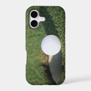 Golf Ball on the edge of hole