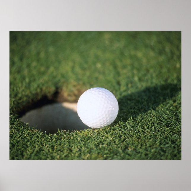 Golf Ball on the edge of hole Poster (Front)