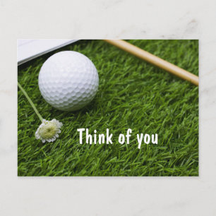 Golf ball with a little flower on grass think of U Postcard