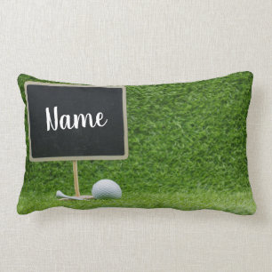 Golf ball with blank chalkboard on green grass lumbar cushion