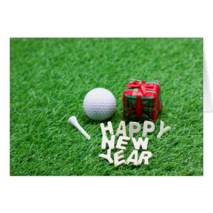 Golf Ball with Happy New Year on Green Grass