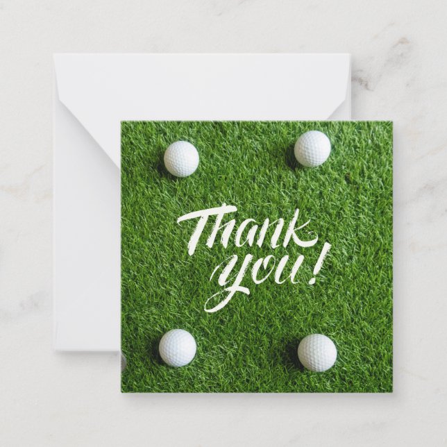 Golf ball with thank you word on green grass card (Front)