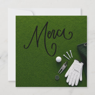 Golf  ball with word thank you on putting green card