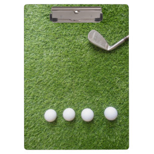 Golf balls are on green grass notebook clipboard