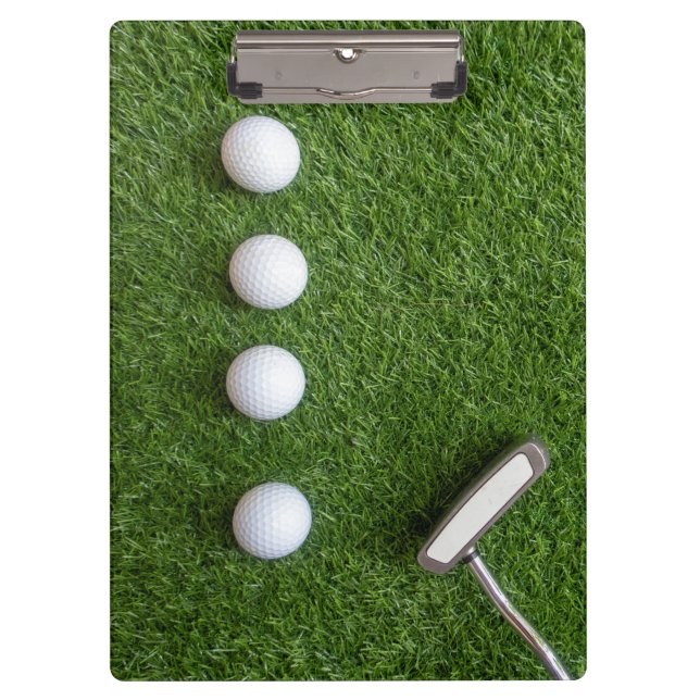 Golf balls on green grass for golfer clipboard (Front)