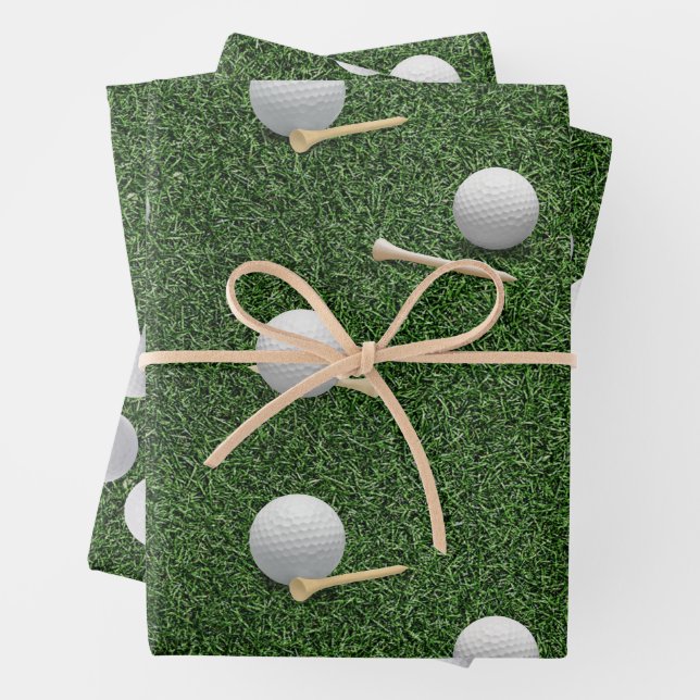 Golf balls on green grass wrapping paper sheet (In situ)
