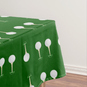 Golf balls pattern on green tablecloth