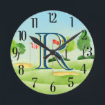 Golf Course Custom Monogram  Round Clock<br><div class="desc">UNIQUE LAYERING OF THE MONOGRAM -- look closely and you will see three colours, which gives it the feeling of depth. Personalised additionally with the first name and set on a golf course. Special idea for a gift or you might just enjoy for yourself! If you have any design questions...</div>