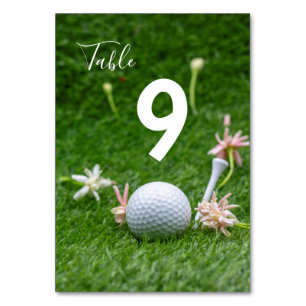 Golf Table number with golf ball and tee on green
