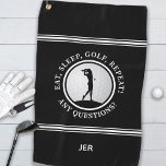 Golfer Monogram Funny Quote Sports Pro Golf Black Golf Towel<br><div class="desc">Modern design features a black background showcasing a realistic golf ball with a female golfer silhouette in black accented with white stripes. Fun golf quote text reads, "Eat, Sleep, Golf, Repeat! Any Questions" in white typography. Customise with name, initials or short line of custom text. Contact beachpausedesigns@gmail.com or message me...</div>