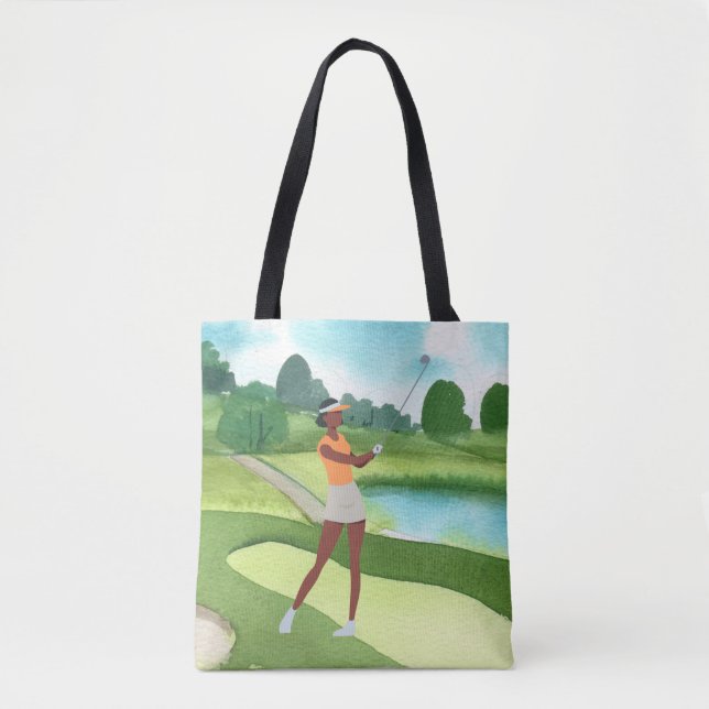 Golfer woman golfing on green grass blue sky   tote bag (Front)