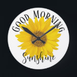 Good Morning Sunshine Sunflower Round Clock<br><div class="desc">A close-up photo of a bright yellow sunflower with text "Good Morning Sunshine" on white background. If you want to,  you can replace the word Sunshine with a name or other text.</div>