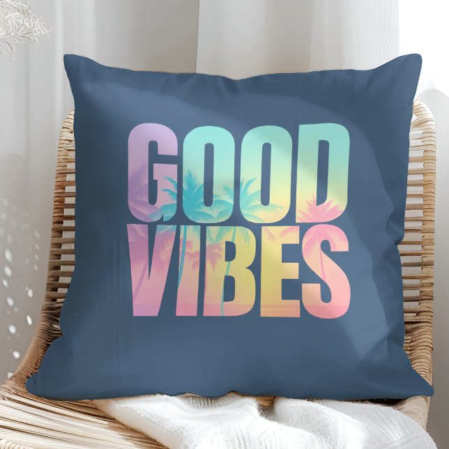 "Good Vibes" Vibrant Tropical Quote Cushion ("Good Vibes" Vibrant Tropical Quote Throw Pillow on a sunny rattan armchair.)