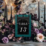 Gothic Black Raven & Black Arch Teal Wedding Table Number<br><div class="desc">Transport your guests to a world of dark, enchanting elegance with our vintage gothic wedding table number card. The deep, aged teal green background sets the stage for a striking contrast, as bold white text emerges from intricate black text boxes. At the pinnacle of this invitation, a three-dimensional gothic border...</div>