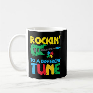 Grab this cute Rockin To Different Tune Guitar T-S Coffee Mug