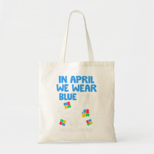 Grab this funny In April We Wear Blue Dinosaur Hol Tote Bag