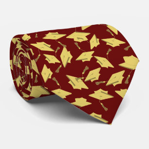 Graduation Maroon and Gold Caps in the Air Tie