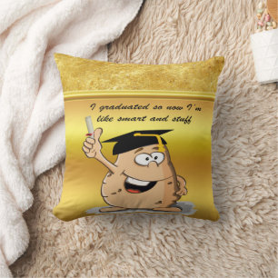 Graduation potato character with a degree cushion