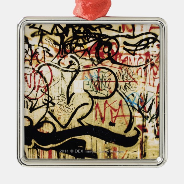 Graffiti on a wall metal ornament (Front)