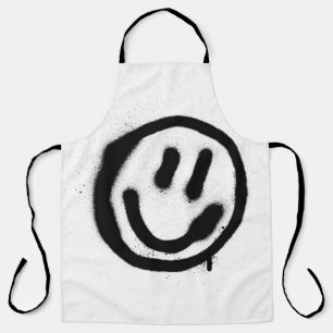 graffiti smiling face emoticon in black on whitesp apron