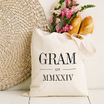 Gram Roman Numeral Year Established Tote Bag<br><div class="desc">A modern minimalist tote bag to celebrate a chic grandma,  this clean minimal tote features "Gram" or your choice of grandma nickname in black serif lettering. Customise with the year she became a grandmother beneath in elegant roman numerals for a chic touch.</div>