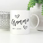 Grammie Year Established Grandma Coffee Mug<br><div class="desc">Create a sweet keepsake for grandma with this simple design that features "Grammie" in hand sketched script lettering accented with hearts. Personalise with the year she became a grandmother for a cute Mother's Day or pregnancy announcement gift.</div>