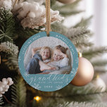 Grandkids Make Life Grand Photo Ceramic Ornament<br><div class="desc">Create a sweet gift for a beloved grandma or grandpa with this beautiful ceramic photo ornament. "Grandkids make life grand" appears along the bottom with white snowflake accents. Personalise with the year beneath,  and the grandchildren's names curving across the top. Add a second photo to the back.</div>
