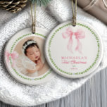 Grandmillenial Bows Baby's First Christmas Photo Ceramic Ornament<br><div class="desc">Grandmillennial baby’s first Christmas photo ornament features a delicate and timeless design that captures the joy of welcoming a new little one during the holiday season. The front includes soft pink script and serif fonts framed by a green laurel wreath and topped with a watercolor-style pink bow for a classic...</div>