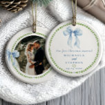 Grandmillennial Bows First Christmas Married Photo Ceramic Ornament<br><div class="desc">Grandmillennial “Our First Christmas Married” photo ornament with watercolor blue bows and green laurel wreath is a charming keepsake that celebrates love with timeless elegance. The front features romantic serif and script fonts in classic blue, encircled by a soft green leafy border and topped with a hand-painted blue ribbon illustration....</div>