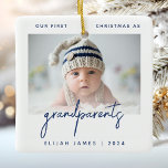 Grandparents 1st Christmas Photo Minimalist Blue Ceramic Ornament<br><div class="desc">Help them celebrate the arrival of their first grandchild with this modern minimalist photo keepsake ornament. The navy blue text reads "Our first Christmas as grandparents, " with the word "grandparents" in trendy handwriting script. Easily replace the sample image with your favourite photo of the new baby, and add his...</div>