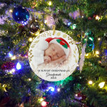 Grandparents First Christmas Photo Gold Foliage Ceramic Ornament<br><div class="desc">This elegant Grandparents Christmas Ornament is decorated with gold foliage on a white background. Easily customisable with baby's photo and year. Please note that the small white stars are not included in the design. Because we create our own artwork you won't find this exact image from other designers. Original Watercolor...</div>