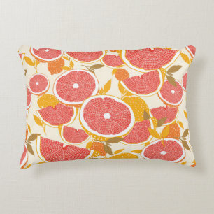 Grapefruit and halved slices with leaves on white. decorative cushion