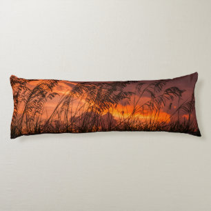Grass silhouettes at sunset body cushion