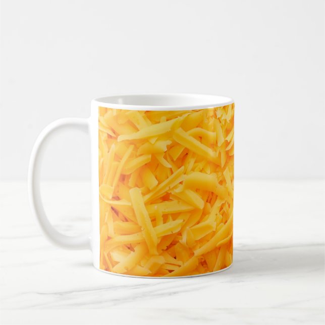 grated cheddar cheese top view coffee mug (Left)