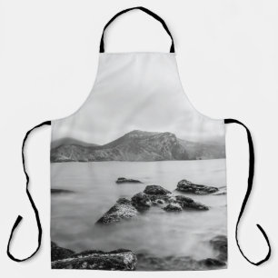 GRAY AND BLACK MOUNTAIN NEAR OF BODY WATER APRON