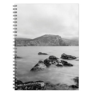 GRAY AND BLACK MOUNTAIN NEAR OF BODY WATER NOTEBOOK