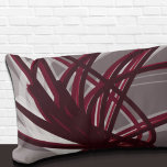 Gray and Burgundy Artistic Abstract Ribbons Lumbar Cushion<br><div class="desc">Gray and burgundy lumbar pillow features an artistic abstract ribbon composition with shades of burgundy and gray with white accents on a gray background. This abstract composition is built on combinations of repeated ribbons, which are overlapped and interlaced to form an intricate and complex abstract pattern. The gray, burgundy, white...</div>