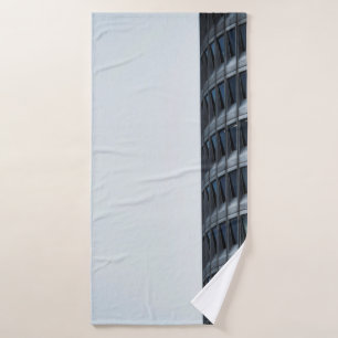 GRAY CONCRETE BUILDING UNDER WHITE SKY DURING DAYT BATH TOWEL