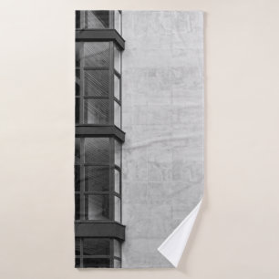 GRAY CONCRETE BUILDING WITH GLASS WINDOW BATH TOWEL