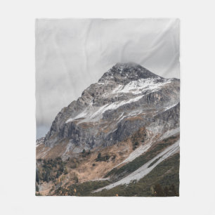 GRAY MOUNTAINS WITH SNOW CAPPED SURROUNDED WITH TR FLEECE BLANKET