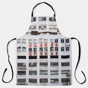 GRAY MULTISTORY BUILDING WITH RED ORIENTAL SCRIPT APRON