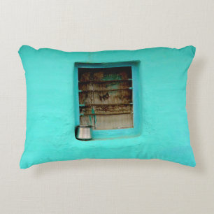 GRAY STEEL CONTAINER ON WINDOW WITH TEAL PAINT DECORATIVE CUSHION