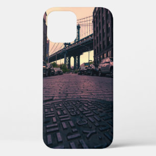 GRAY VEHICLE AT ROAD BESIDE CONCRETE BUILDING iPhone 12 CASE