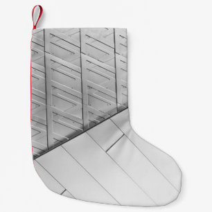 Grayscale photo of flooring small christmas stocking